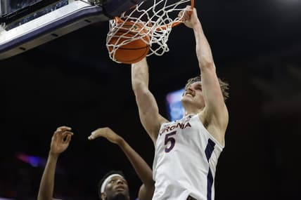 Jan 10, 2023; Charlottesville, Virginia, USA; Virginia Cavaliers forward Ben Vander Plas (5) dunks the ball as North Carolina Tar Heels forward Jalen Washington (13) looks on in the second half at John Paul Jones Arena. Mandatory Credit: Geoff Burke-USA TODAY Sports