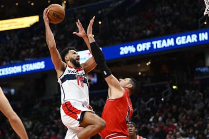 Jan 11, 2023; Washington, District of Columbia, USA; Washington Wizards forward Anthony Gill (16) shoots over Chicago Bulls center Nikola Vucevic (9) during the first half at Capital One Arena. Mandatory Credit: Brad Mills-USA TODAY Sports