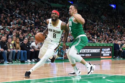 Jan 11, 2023; Boston, Massachusetts, USA;  New Orleans Pelicans forward Naji Marshall (8) drives to the basket as Boston Celtics forward Grant Williams (12) defends during the first half at TD Garden. Mandatory Credit: Bob DeChiara-USA TODAY Sports