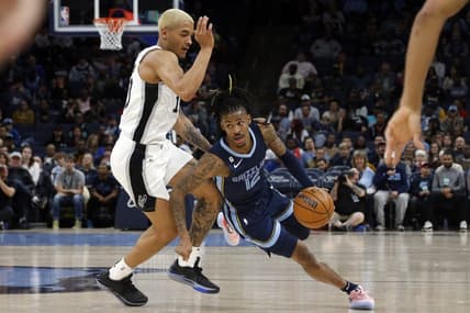 Jan 11, 2023; Memphis, Tennessee, USA; Memphis Grizzlies guard Ja Morant (12) drives to the basket as San Antonio Spurs forward Jeremy Sochan (10) defends during the first half at FedExForum. Mandatory Credit: Petre Thomas-USA TODAY Sports