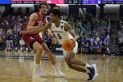 Jan 11, 2023; Evanston, Illinois, USA; Rutgers Scarlet Knights forward Dean Reiber (21) defends Northwestern Wildcats guard Julian Roper II (5) during the second half at Welsh-Ryan Arena. Mandatory Credit: David Banks-USA TODAY Sports