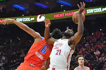 Jan 12, 2023; Philadelphia, Pennsylvania, USA; Oklahoma City Thunder forward Jaylin Williams (6) and Philadelphia 76ers center Joel Embiid (21) battle for the ball during the first quarter at Wells Fargo Center. Mandatory Credit: Eric Hartline-USA TODAY Sports