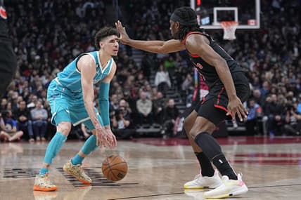 Jan 12, 2023; Toronto, Ontario, CAN; Toronto Raptors forward Precious Achiuwa (5) defends against Charlotte Hornets guard LaMelo Ball (1) during the first half at Scotiabank Arena. Mandatory Credit: John E. Sokolowski-USA TODAY Sports