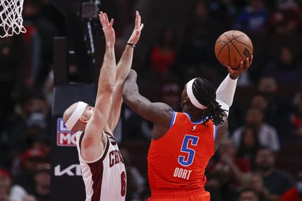 Jan 13, 2023; Chicago, Illinois, USA; Oklahoma City Thunder guard Luguentz Dort (5) goes to the basket against Chicago Bulls guard Alex Caruso (6) during the first half at United Center. Mandatory Credit: Kamil Krzaczynski-USA TODAY Sports