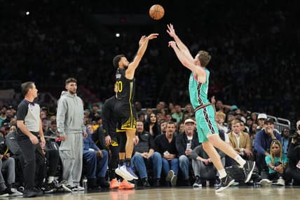 Jan 13, 2023; San Antonio, Texas, USA;  Golden State Warriors guard Stephen Curry (30) shoots over San Antonio Spurs center Jakob Poeltl (25) in the first half at the Alamodome. Mandatory Credit: Daniel Dunn-USA TODAY Sports