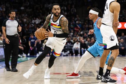 Jan 13, 2023; Minneapolis, Minnesota, USA; Minnesota Timberwolves guard D'Angelo Russell (0) dribbles while Phoenix Suns guard Damion Lee (10) defends during the second quarter at Target Center. Mandatory Credit: Matt Krohn-USA TODAY Sports