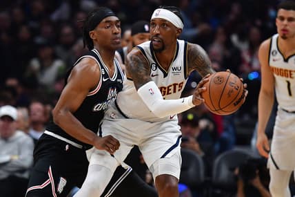 January 13, 2023; Los Angeles, California, USA; Denver Nuggets guard Kentavious Caldwell-Pope (5) moves the ball against Los Angeles Clippers guard Terance Mann (14) during the first half at Crypto.com Arena. Mandatory Credit: Gary A. Vasquez-USA TODAY Sports