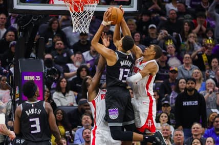 Jan 13, 2023; Sacramento, California, USA; Sacramento Kings forward Keegan Murray (13) is guarded by Houston Rockets forward Jabari Smith Jr. (1) and forward Jae'Sean Tate (8) during the second quarter at Golden 1 Center. Mandatory Credit: Sergio Estrada-USA TODAY Sports