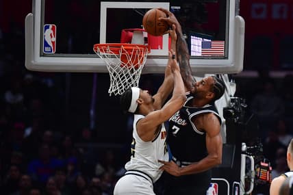 January 13, 2023; Los Angeles, California, USA; Los Angeles Clippers forward Kawhi Leonard (2) dunks against Denver Nuggets forward Zeke Nnaji (22) during the second half at Crypto.com Arena. Mandatory Credit: Gary A. Vasquez-USA TODAY Sports