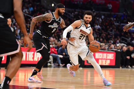 January 13, 2023; Los Angeles, California, USA; Denver Nuggets guard Jamal Murray (27) moves the ball against Los Angeles Clippers forward Marcus Morris Sr. (8) during the second half at Crypto.com Arena. Mandatory Credit: Gary A. Vasquez-USA TODAY Sports