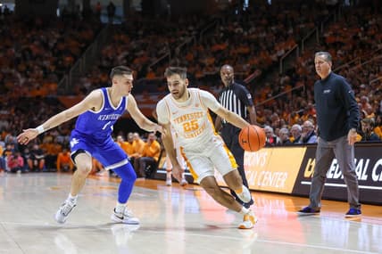 Jan 14, 2023; Knoxville, Tennessee, USA; Tennessee Volunteers guard Santiago Vescovi (25) moves the ball against Kentucky Wildcats guard CJ Fredrick (1) during the first half at Thompson-Boling Arena. Mandatory Credit: Randy Sartin-USA TODAY Sports