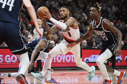 Jan 14, 2023; Portland, Oregon, USA; Portland Trail Blazers guard Damian Lillard (0) drives to the basket during the first half against Dallas Mavericks forward Reggie Bullock (25) at Moda Center. Mandatory Credit: Troy Wayrynen-USA TODAY Sports