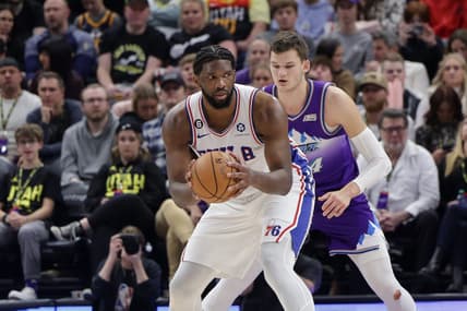 Jan 14, 2023; Salt Lake City, Utah, USA;  Philadelphia 76ers center Joel Embiid (21) keeps the ball away from Utah Jazz center Walker Kessler (24) during the second half at Vivint Arena. Mandatory Credit: Chris Nicoll-USA TODAY Sports