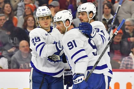 Jan 8, 2023; Philadelphia, Pennsylvania, USA; Toronto Maple Leafs right wing William Nylander (88), center John Tavares (91), and center Auston Matthews (34) celebrate a goal against the Philadelphia Flyers at Wells Fargo Center. Mandatory Credit: Eric Hartline-USA TODAY Sports