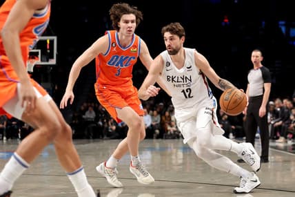 Jan 15, 2023; Brooklyn, New York, USA; Brooklyn Nets forward Joe Harris (12) drives to the basket against Oklahoma City Thunder guard Josh Giddey (3) during the second quarter at Barclays Center. Mandatory Credit: Brad Penner-USA TODAY Sports