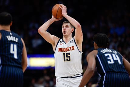Jan 15, 2023; Denver, Colorado, USA; Denver Nuggets center Nikola Jokic (15) controls the ball against Orlando Magic center Wendell Carter Jr. (34) and guard Jalen Suggs (4) in the first quarter at Ball Arena. Mandatory Credit: Isaiah J. Downing-USA TODAY Sports
