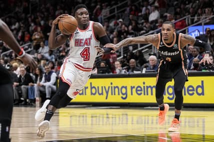 Jan 16, 2023; Atlanta, Georgia, USA; Miami Heat guard Victor Oladipo (4) drives to the basket defended by Atlanta Hawks guard Dejounte Murray (5) during the first half at State Farm Arena. Mandatory Credit: Dale Zanine-USA TODAY Sports