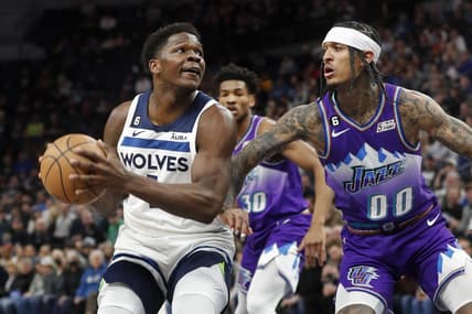 Jan 16, 2023; Minneapolis, Minnesota, USA; Minnesota Timberwolves forward Anthony Edwards (1) works against Utah Jazz guard Jordan Clarkson (00) in the first quarter at Target Center. Mandatory Credit: Bruce Kluckhohn-USA TODAY Sports