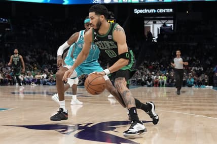 Jan 16, 2023; Charlotte, North Carolina, USA; Boston Celtics forward Jayson Tatum (0) drives to the basket guarded by Charlotte Hornets forward Jalen McDaniels (6) during the first quarter at Spectrum Center. Mandatory Credit: Jim Dedmon-USA TODAY Sports