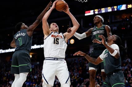 Jan 18, 2023; Denver, Colorado, USA; Denver Nuggets center Nikola Jokic (15) is fouled by Minnesota Timberwolves forward Jaden McDaniels (3) as he battles for a rebound with Minnesota Timberwolves guard Anthony Edwards (1) and center Naz Reid (11) in the second quarter at Ball Arena. Mandatory Credit: Isaiah J. Downing-USA TODAY Sports