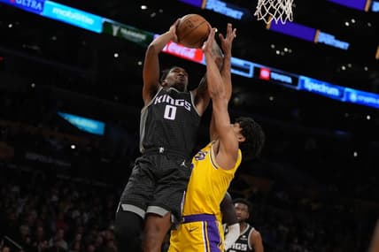 Jan 18, 2023; Los Angeles, California, USA; Sacramento Kings guard Malik Monk (0) shoots the ball against Los Angeles Lakers guard Max Christie (10) in the first half at Crypto.com Arena. Mandatory Credit: Kirby Lee-USA TODAY Sports