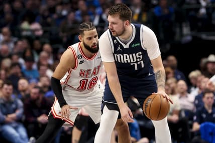 Jan 20, 2023; Dallas, Texas, USA;  Dallas Mavericks guard Luka Doncic (77) controls the ball as Miami Heat forward Caleb Martin (16) defends during the second quarter at American Airlines Center. Mandatory Credit: Kevin Jairaj-USA TODAY Sports