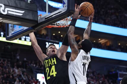 Jan 20, 2023; Salt Lake City, Utah, USA; Brooklyn Nets guard Kyrie Irving (11) drives to the basket against Utah Jazz center Walker Kessler (24) in the second quarter at Vivint Arena. Mandatory Credit: Rob Gray-USA TODAY Sports