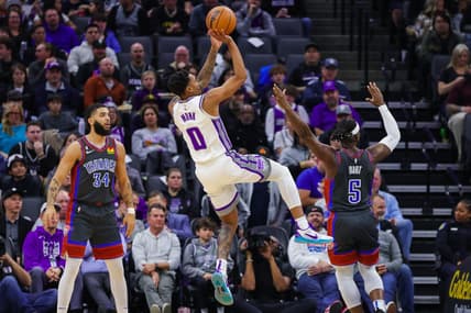 Jan 20, 2023; Sacramento, California, USA; Sacramento Kings guard Malik Monk (0) shoots the ball against Oklahoma City Thunder guard Luguentz Dort (5) during the second quarter at Golden 1 Center. Mandatory Credit: Sergio Estrada-USA TODAY Sports