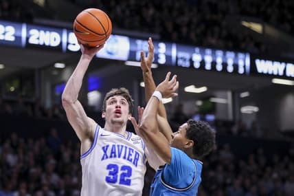 Jan 21, 2023; Cincinnati, Ohio, USA; Xavier Musketeers forward Zach Freemantle (32) shoots against Georgetown Hoyas guard Wayne Bristol Jr. (31) in the second half at Cintas Center. Mandatory Credit: Katie Stratman-USA TODAY Sports