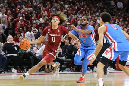 Jan 21, 2023; Fayetteville, Arkansas, USA; Arkansas Razorbacks guard Anthony Black (0) drives against Ole Miss Rebels guard Amaree Abram (1) during the second half at Bud Walton Arena. Arkansas won 69-57. Mandatory Credit: Nelson Chenault-USA TODAY Sports