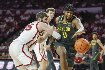 Jan 21, 2023; Norman, Oklahoma, USA; Baylor Bears forward Flo Thamba (0) reaches for a loose ball as Oklahoma Sooners forward Tanner Groves (35) defends during the first half at Lloyd Noble Center. Mandatory Credit: Alonzo Adams-USA TODAY Sports