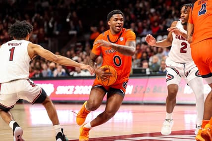 Jan 21, 2023; Columbia, South Carolina, USA; Auburn Tigers guard K.D. Johnson (0) drives past South Carolina Gamecocks guard Jacobi Wright (1) in the first half at Colonial Life Arena. Mandatory Credit: Jeff Blake-USA TODAY Sports