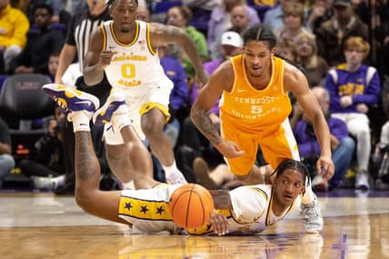 Jan 21, 2023; Baton Rouge, Louisiana, USA;  LSU Tigers forward Derek Fountain (20) knocks the ball away from Tennessee Volunteers guard Zakai Zeigler (5) during the first half at Pete Maravich Assembly Center. Mandatory Credit: Stephen Lew-USA TODAY Sports