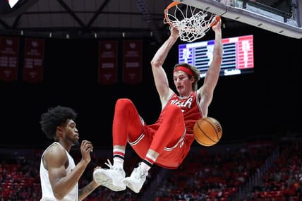 Jan 21, 2023; Salt Lake City, Utah, USA; Utah Utes center Branden Carlson (right) dunks against Washington Huskies forward Keion Brooks (left) in the second half at Jon M. Huntsman Center. Mandatory Credit: Rob Gray-USA TODAY Sports