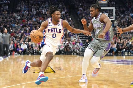 Jan 21, 2023; Sacramento, California, USA; Philadelphia 76ers guard Tyrese Maxey (0) dribbles against Sacramento Kings guard Davion Mitchell (15) during the first quarter at Golden 1 Center. Mandatory Credit: Darren Yamashita-USA TODAY Sports