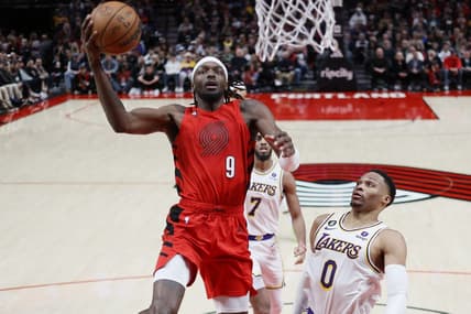 Jan 22, 2023; Portland, Oregon, USA; Portland Trail Blazers small forward Jerami Grant (9) drives to the basket past Los Angeles Lakers point guard Russell Westbrook (0) during the first half at Moda Center. Mandatory Credit: Soobum Im-USA TODAY Sports