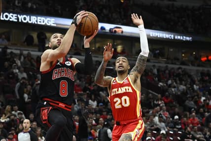 Jan 23, 2023; Chicago, Illinois, USA; Chicago Bulls guard Zach LaVine (8) goes to the basket against Atlanta Hawks forward John Collins (20) during the first half at the United Center. Mandatory Credit: Matt Marton-USA TODAY Sports