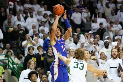 Jan 23, 2023; Waco, Texas, USA; Kansas Jayhawks forward Jalen Wilson (10) scores a three-point basket against Baylor Bears forward Caleb Lohner (33) during the first half at Ferrell Center. Mandatory Credit: Chris Jones-USA TODAY Sports