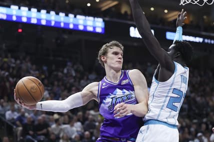 Jan 23, 2023; Salt Lake City, Utah, USA; Utah Jazz forward Lauri Markkanen (23) passes the ball around Charlotte Hornets forward JT Thor (21) in the second quarter at Vivint Arena. Mandatory Credit: Rob Gray-USA TODAY Sports
