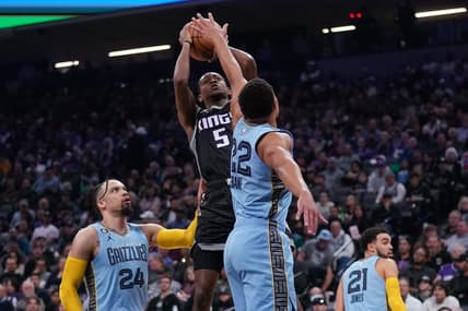Jan 23, 2023; Sacramento, California, USA; Sacramento Kings guard De'Aaron Fox (5) makes a shot over Memphis Grizzlies guard Desmond Bane (22) in the first quarter at the Golden 1 Center. Mandatory Credit: Cary Edmondson-USA TODAY Sports