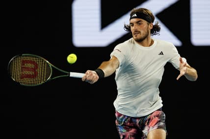Jan 24, 2023; Melbourne, Victoria, Australia;  Stefanos Tsitsipas of Greece hits a shot against Jiri Lehecka of the Czech Republic on day nine of the 2023 Australian Open tennis tournament at Melbourne Park. Mandatory Credit: Mike Frey-USA TODAY Sports