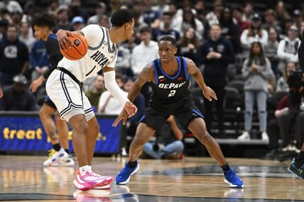 Jan 24, 2023; Washington, District of Columbia, USA; Georgetown Hoyas guard Primo Spears (1) dribbles as DePaul Blue Demons guard Umoja Gibson (2) defends during the first half at Capital One Arena. Mandatory Credit: Brad Mills-USA TODAY Sports