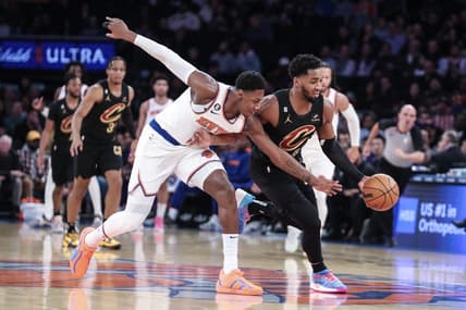 Jan 24, 2023; New York, New York, USA;  New York Knicks guard RJ Barrett (9) and Cleveland Cavaliers guard Donovan Mitchell (45) play for the ball in the first quarter at Madison Square Garden. Mandatory Credit: Wendell Cruz-USA TODAY Sports