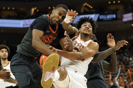 Jan 24, 2023; Austin, Texas, USA; Oklahoma State Cowboys guard Bryce Thompson (1) and Texas Longhorns forward Dillon Mitchell (23) battle for a rebound during the first half at Moody Center. Mandatory Credit: Scott Wachter-USA TODAY Sports