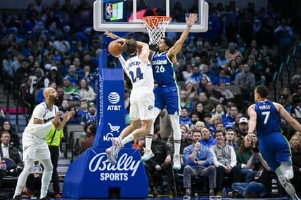 Jan 24, 2023; Dallas, Texas, USA; Washington Wizards forward Corey Kispert (24) looks to move to the basket past Dallas Mavericks guard Spencer Dinwiddie (26) during the second quarter at the American Airlines Center. Mandatory Credit: Jerome Miron-USA TODAY Sports