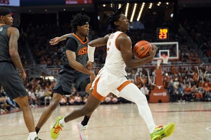 Jan 24, 2023; Austin, Texas, USA; Texas Longhorns guard Marcus Carr (5) drives to the basket past Oklahoma State Cowboys guard Woody Newton (4) during the first half at Moody Center. Mandatory Credit: Scott Wachter-USA TODAY Sports