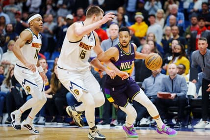 Jan 24, 2023; New Orleans, Louisiana, USA; New Orleans Pelicans guard CJ McCollum (3) fights for position against Denver Nuggets center Nikola Jokic (15) during the fourth quarter at Smoothie King Center. Mandatory Credit: Andrew Wevers-USA TODAY Sports