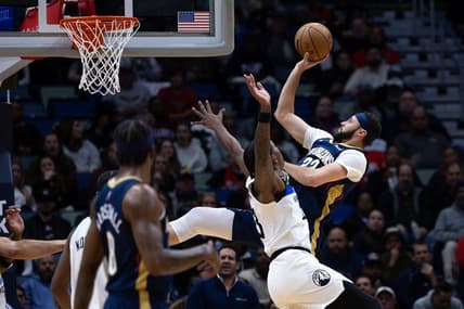 Jan 25, 2023; New Orleans, Louisiana, USA;  New Orleans Pelicans forward Larry Nance Jr. (22) shoots a jump shot against Minnesota Timberwolves forward Jaden McDaniels (3) during the first half at Smoothie King Center. Mandatory Credit: Stephen Lew-USA TODAY Sports