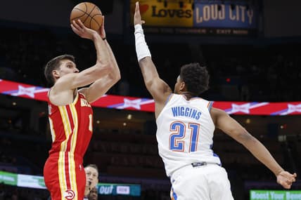 Jan 25, 2023; Oklahoma City, Oklahoma, USA; Atlanta Hawks guard Bogdan Bogdanovic (13) shoots as Oklahoma City Thunder guard Aaron Wiggins (21) defends during the first half at Paycom Center. Mandatory Credit: Alonzo Adams-USA TODAY Sports