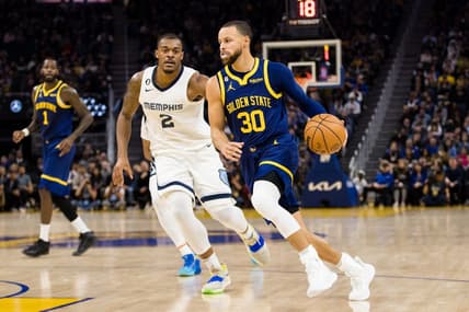Jan 25, 2023; San Francisco, California, USA; Golden State Warriors guard Stephen Curry (30) dribbles past Memphis Grizzlies center Xavier Tillman Sr. (2) during the first half at Chase Center. Mandatory Credit: John Hefti-USA TODAY Sports